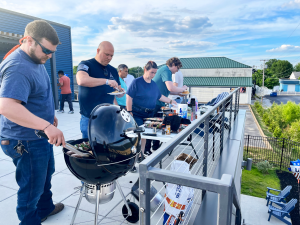 Dressler Automation employees enjoy a rooftop BBQ.
